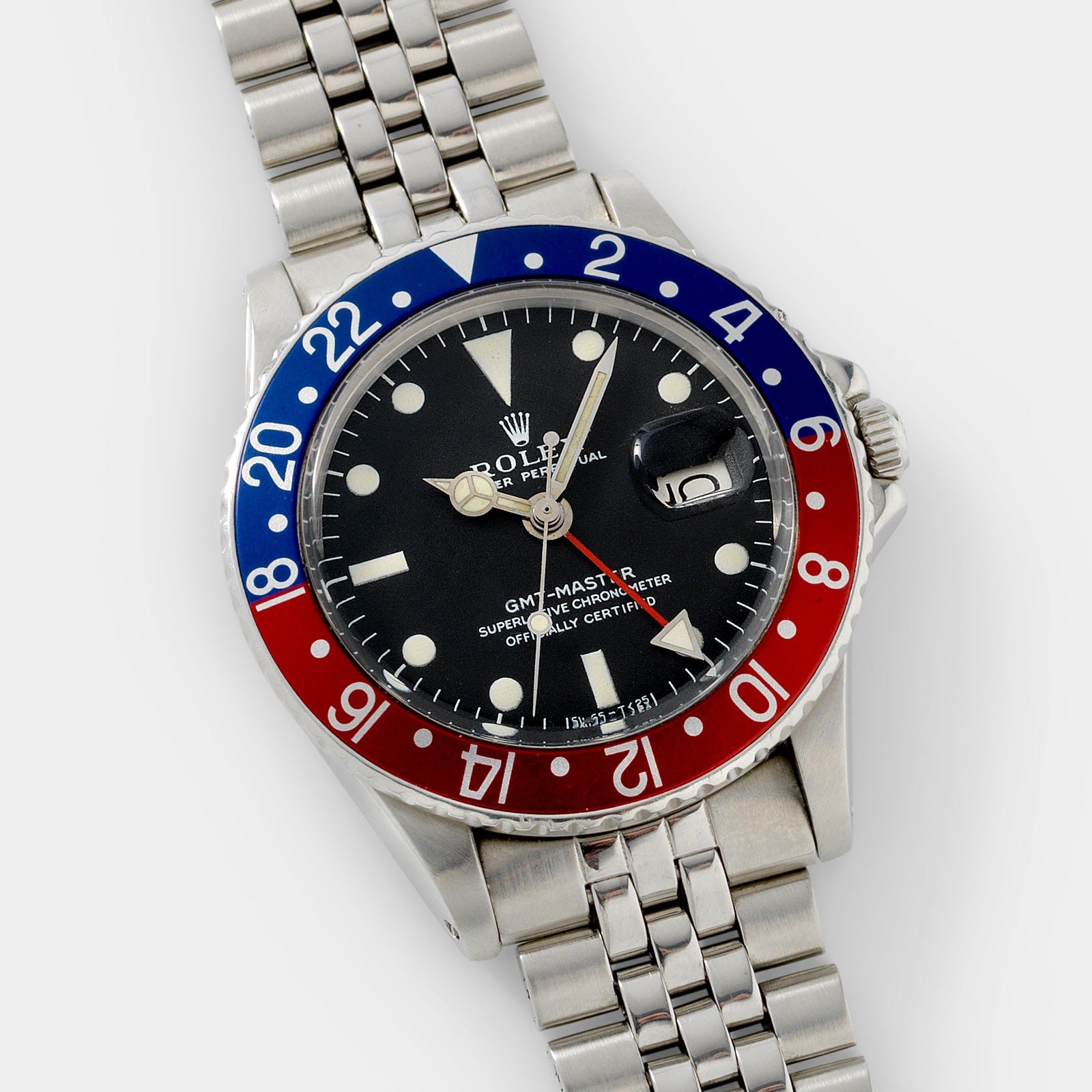 تصویر منبع؛ ساعت مچی Rolex GMT-Master رفرنس 1675 مدل Mk1 Long E همراه با جعبه و مدارک