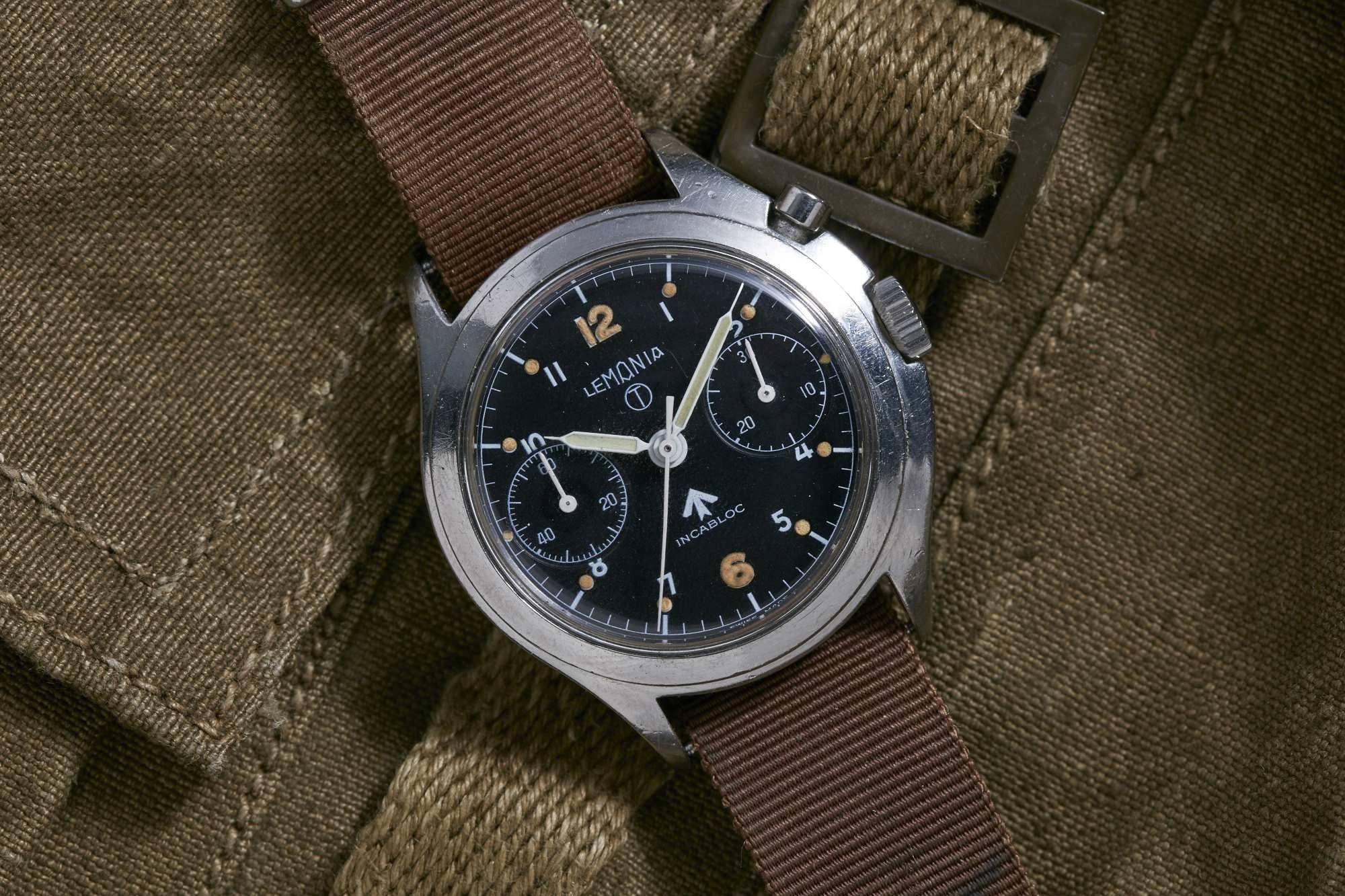 تصویر منبع؛ ساعت مچی نظامی لمانیا Lemania Monopusher Chronograph 6BB سال ۱۹۵۶