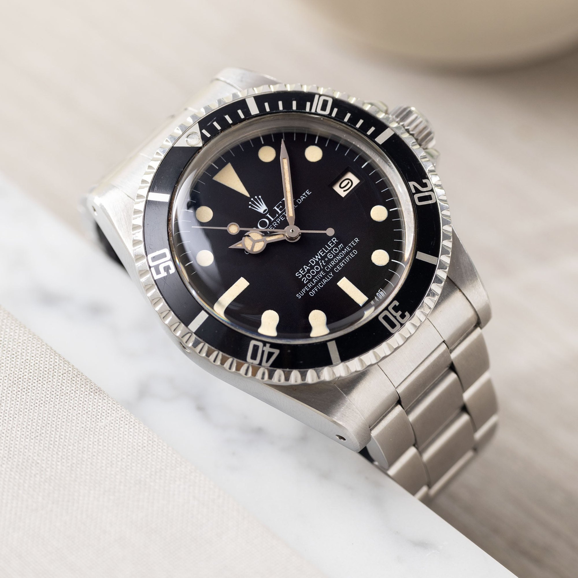 تصویر منبع؛ ساعت مچی رولکس Rolex Sea-Dweller رفرنس 1665 صفحه Mk3 White Dial